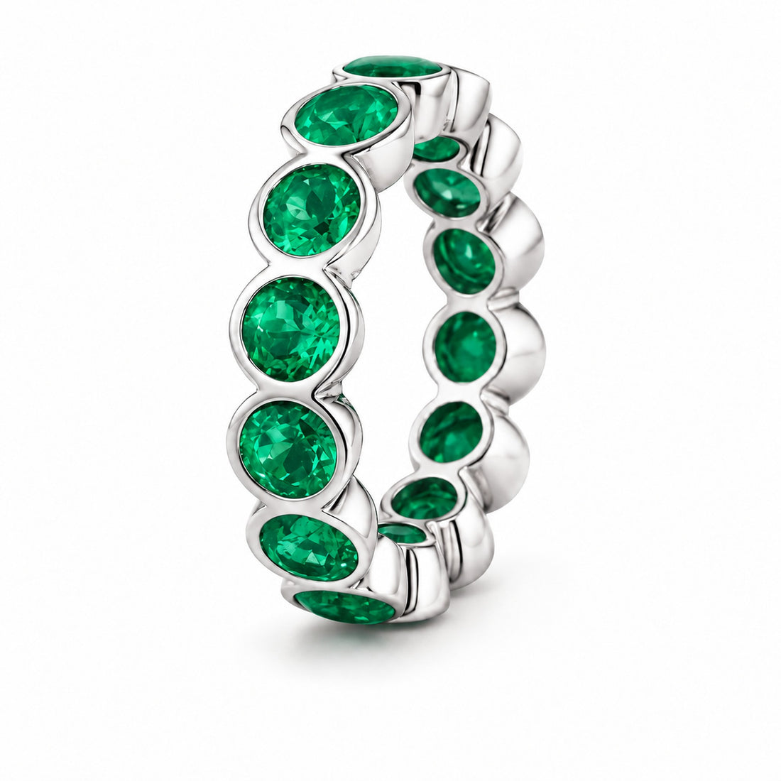 Round Colombian Emerald Bezel-Set Eternity Band in 14K white gold, angle view