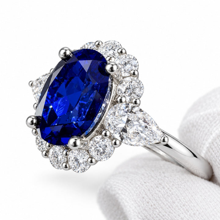 The Modified Diana — Diamond Halo Oval Blue Sapphire Ring in 14K white gold, detail view
