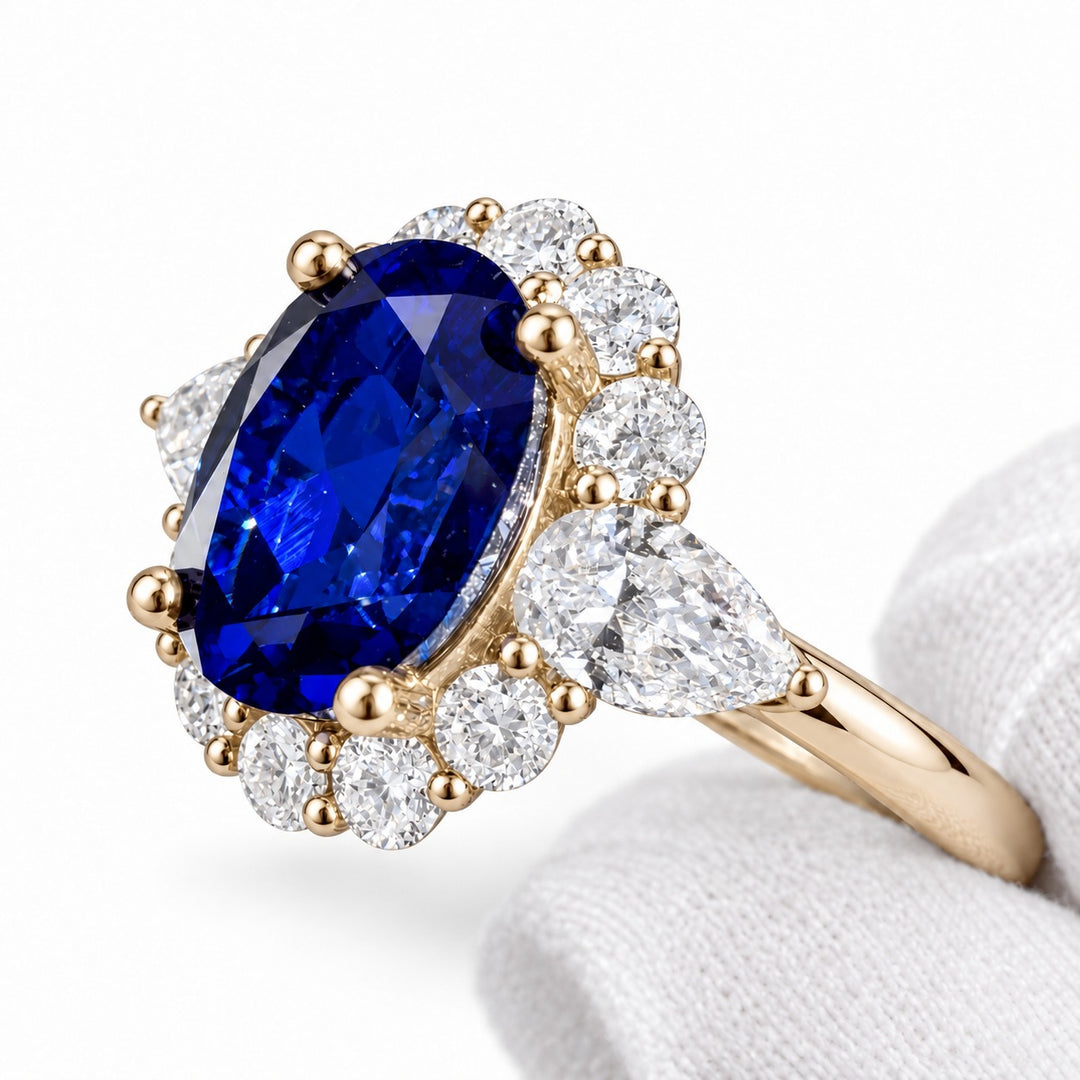 The Modified Diana — Diamond Halo Oval Blue Sapphire Ring in 14K yellow gold, detail view
