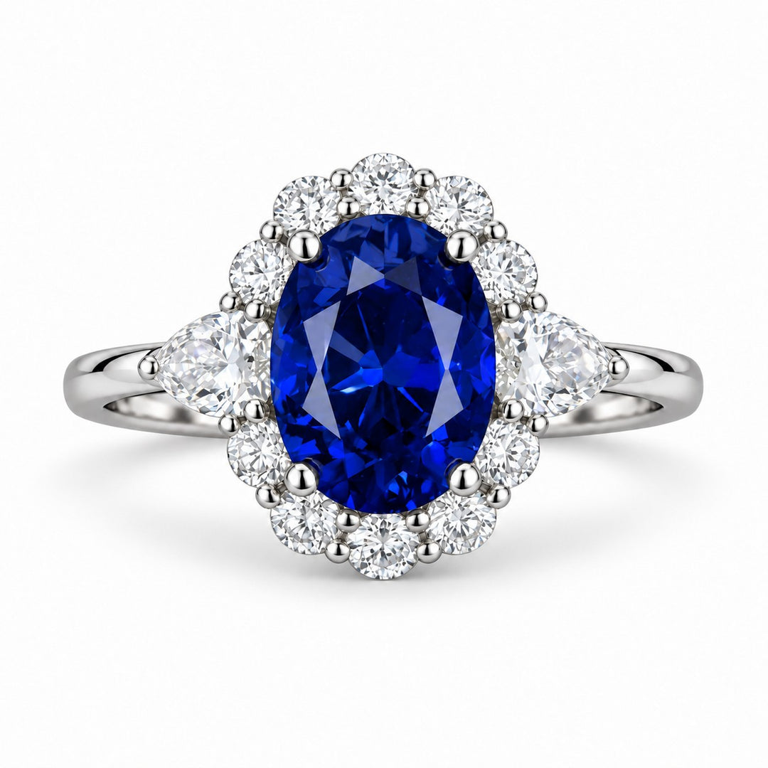 The Modified Diana — Diamond Halo Oval Blue Sapphire Ring in platinum, front view