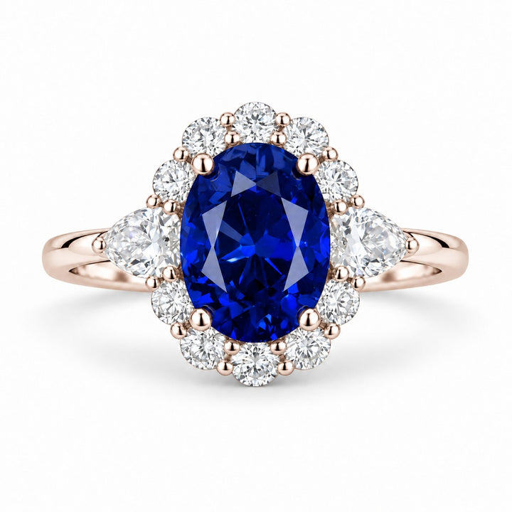 The Modified Diana — Diamond Halo Oval Blue Sapphire Ring in 14K rose gold, front view