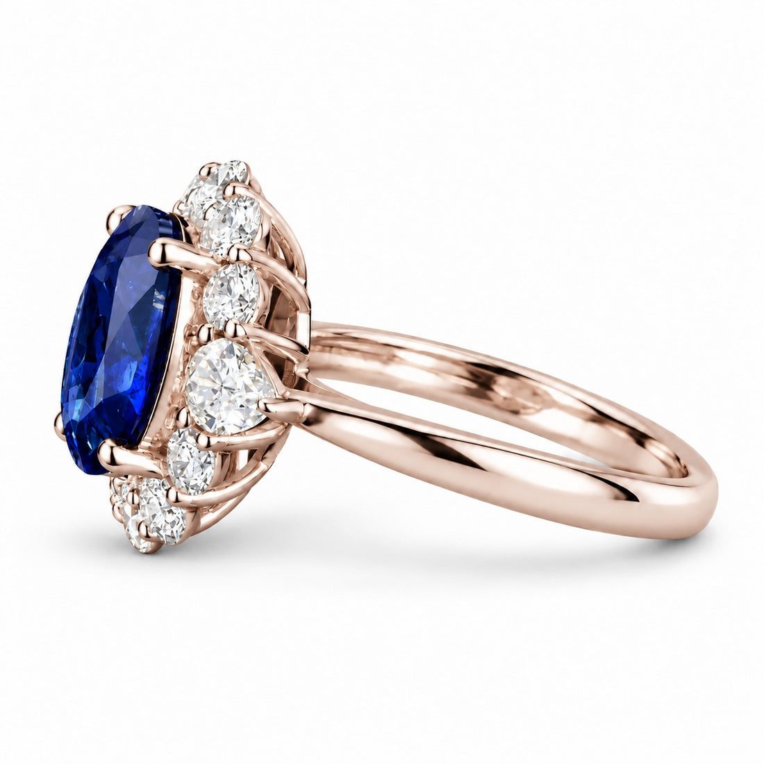 The Modified Diana — Diamond Halo Oval Blue Sapphire Ring in 14K rose gold, side view