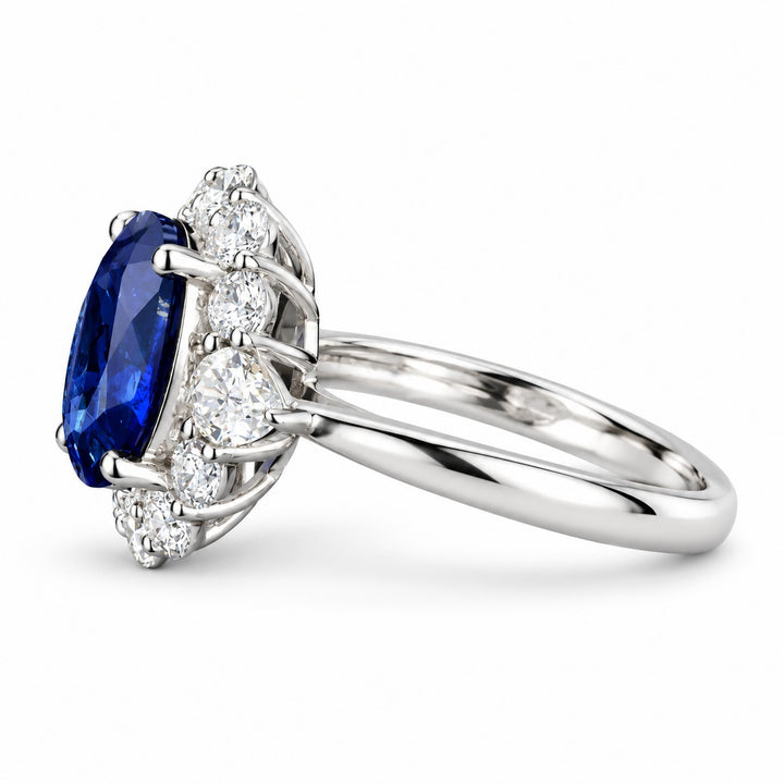 The Modified Diana — Diamond Halo Oval Blue Sapphire Ring in 14K white gold, side view