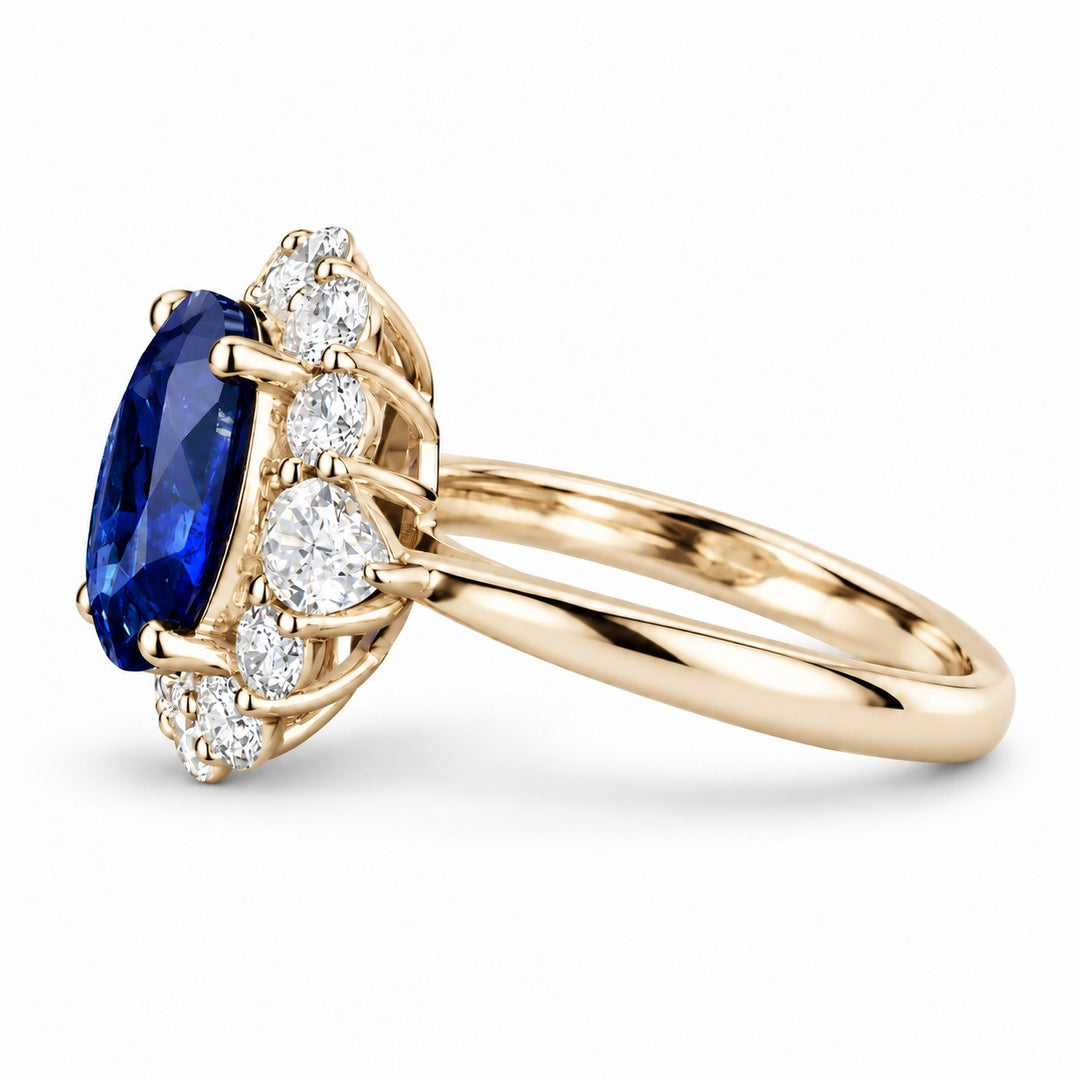 The Modified Diana — Diamond Halo Oval Blue Sapphire Ring in 14K yellow gold, side view