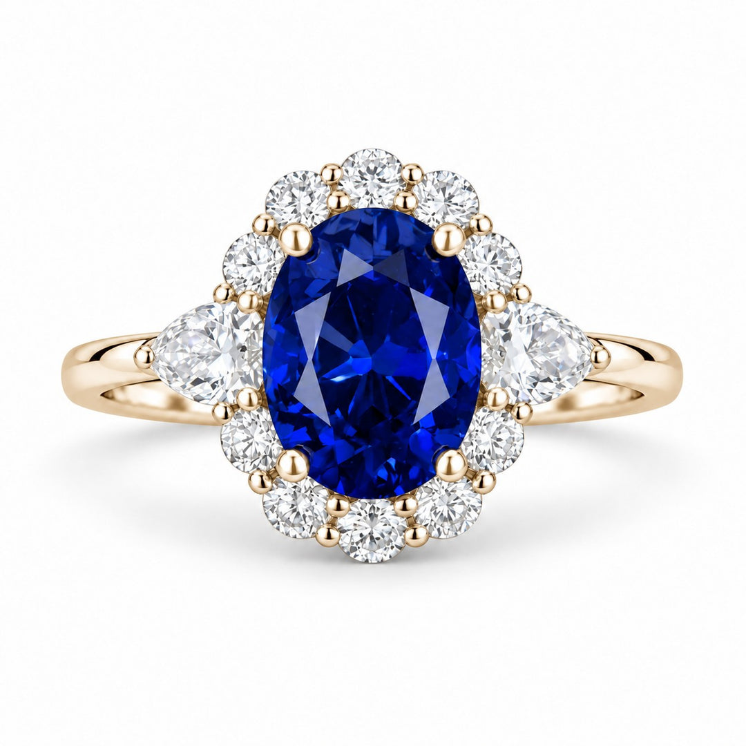 The Modified Diana — Diamond Halo Oval Blue Sapphire Ring in 14K yellow gold, front view
