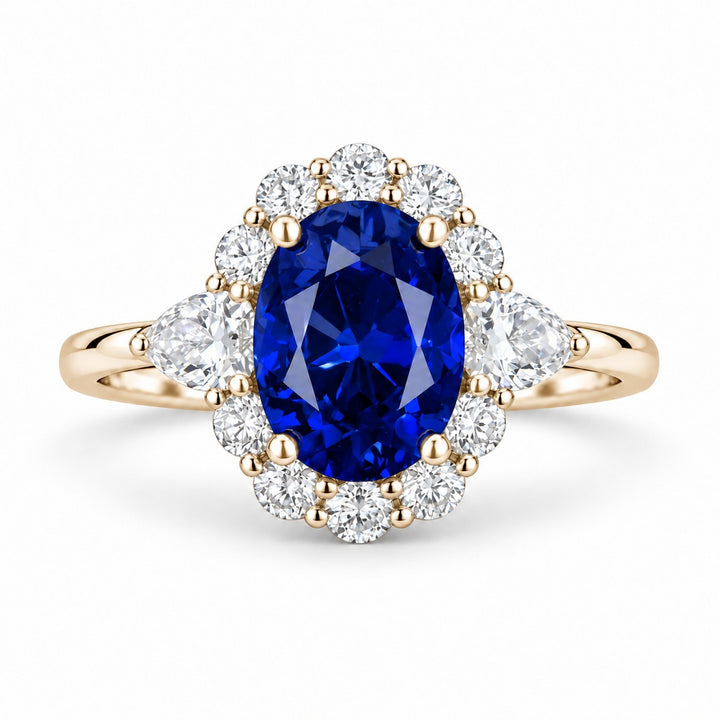 The Modified Diana — Diamond Halo Oval Blue Sapphire Ring in 14K yellow gold, front view