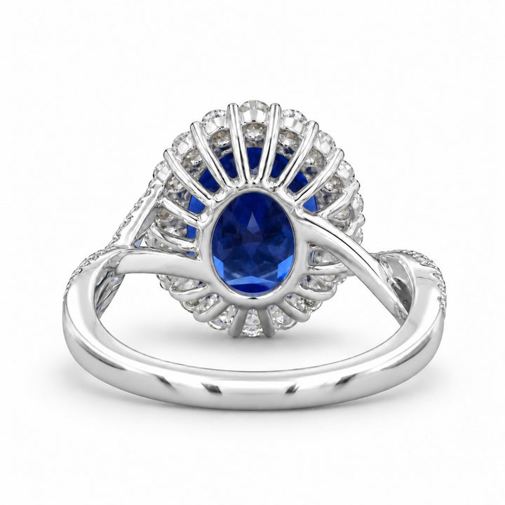 The Twisted Diana — Diamond Halo/Twist Band Oval Blue Sapphire Ring in platinum, back view
