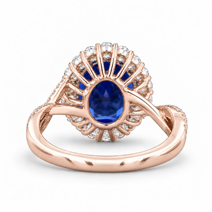 The Twisted Diana — Diamond Halo/Twist Band Oval Blue Sapphire Ring in 14K rose gold, back view
