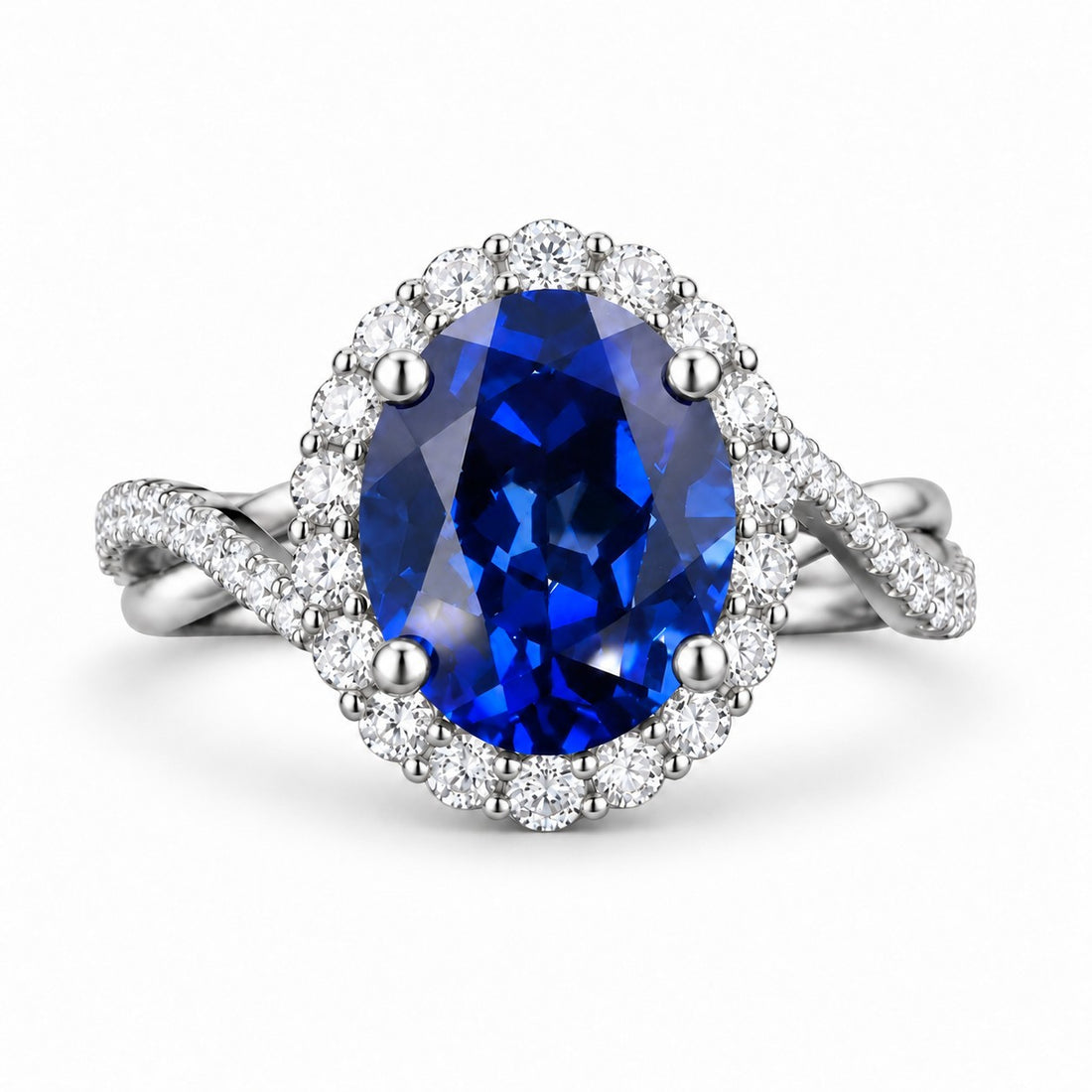 The Twisted Diana — Diamond Halo/Twist Band Oval Blue Sapphire Ring in platinum, front view