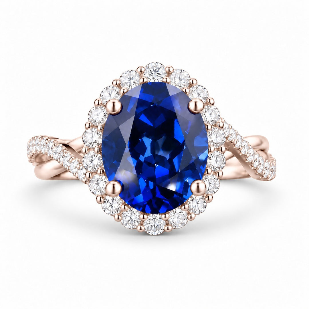 The Twisted Diana — Diamond Halo/Twist Band Oval Blue Sapphire Ring in 14K rose gold, front view