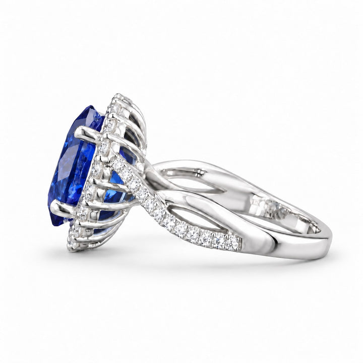 The Twisted Diana — Diamond Halo/Twist Band Oval Blue Sapphire Ring in platinum, side view