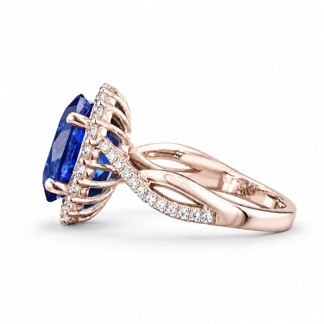 The Twisted Diana — Diamond Halo/Twist Band Oval Blue Sapphire Ring in 14K rose gold, side view