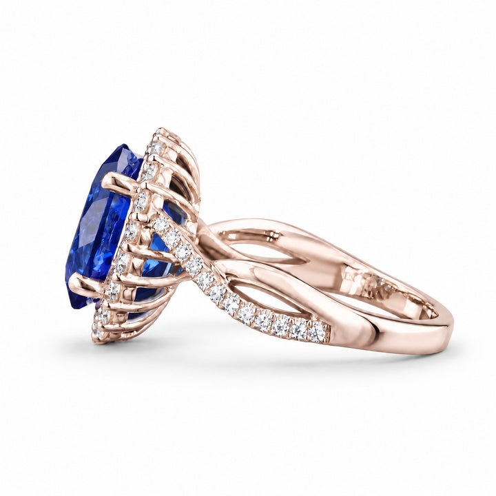 The Twisted Diana — Diamond Halo/Twist Band Oval Blue Sapphire Ring in 14K rose gold, side view