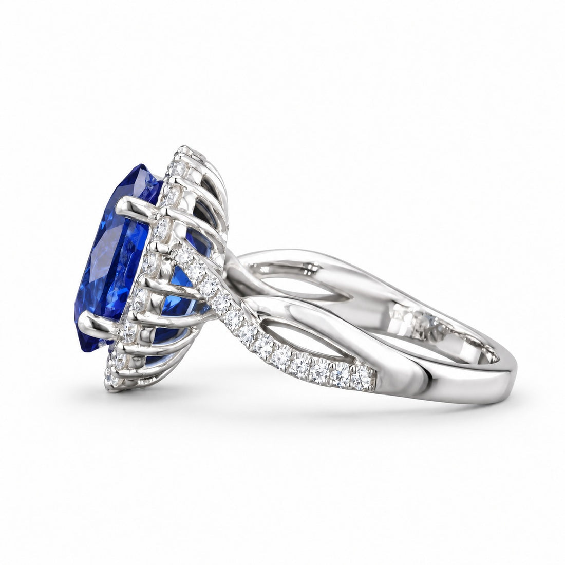 The Twisted Diana — Diamond Halo/Twist Band Oval Blue Sapphire Ring in 14K white gold, side view