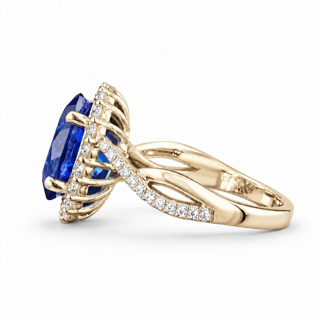 The Twisted Diana — Diamond Halo/Twist Band Oval Blue Sapphire Ring in 14K yellow gold, side view