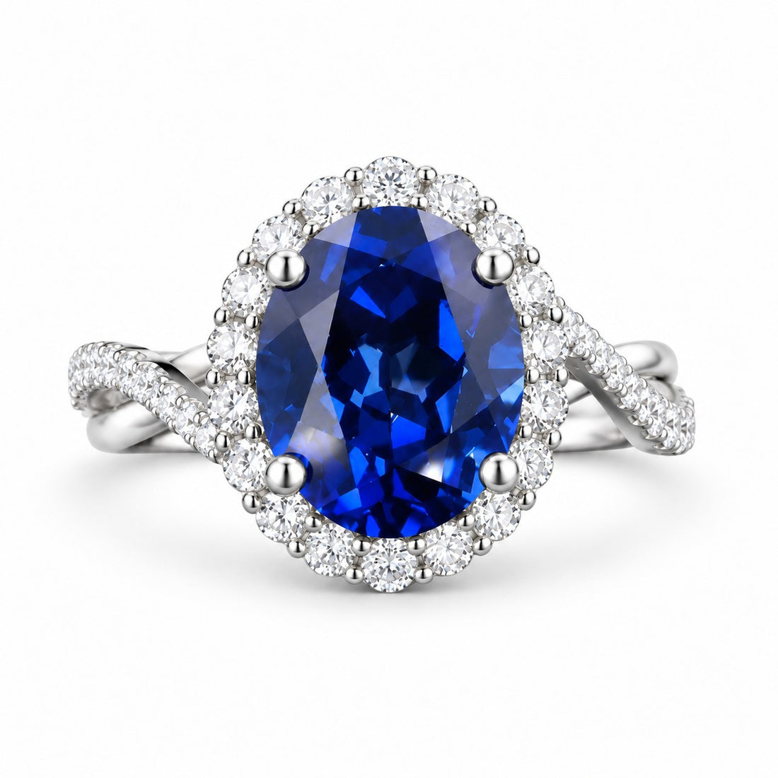 The Twisted Diana — Diamond Halo/Twist Band Oval Blue Sapphire Ring in 14K white gold, front view