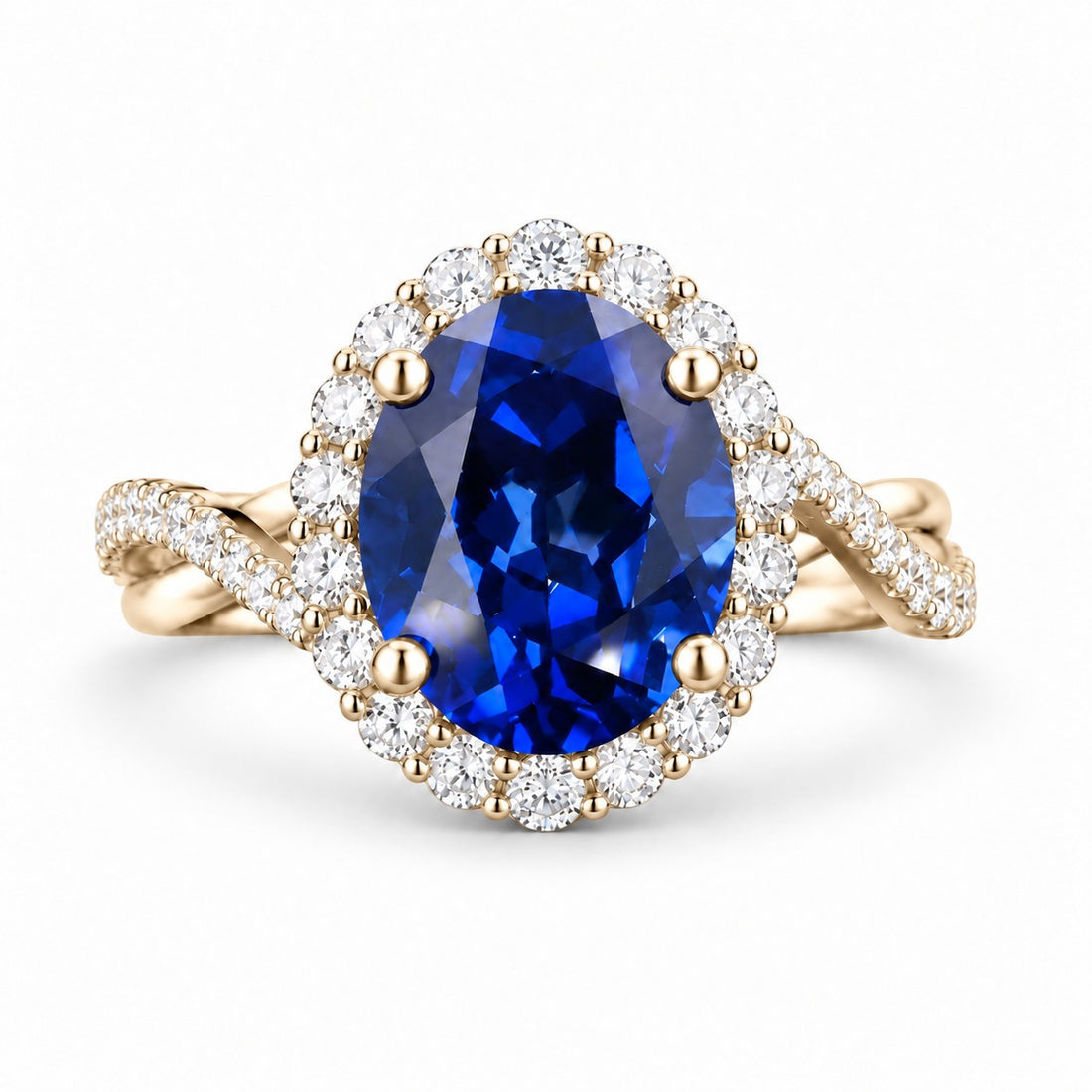 The Twisted Diana — Diamond Halo/Twist Band Oval Blue Sapphire Ring in 14K yellow gold, front view