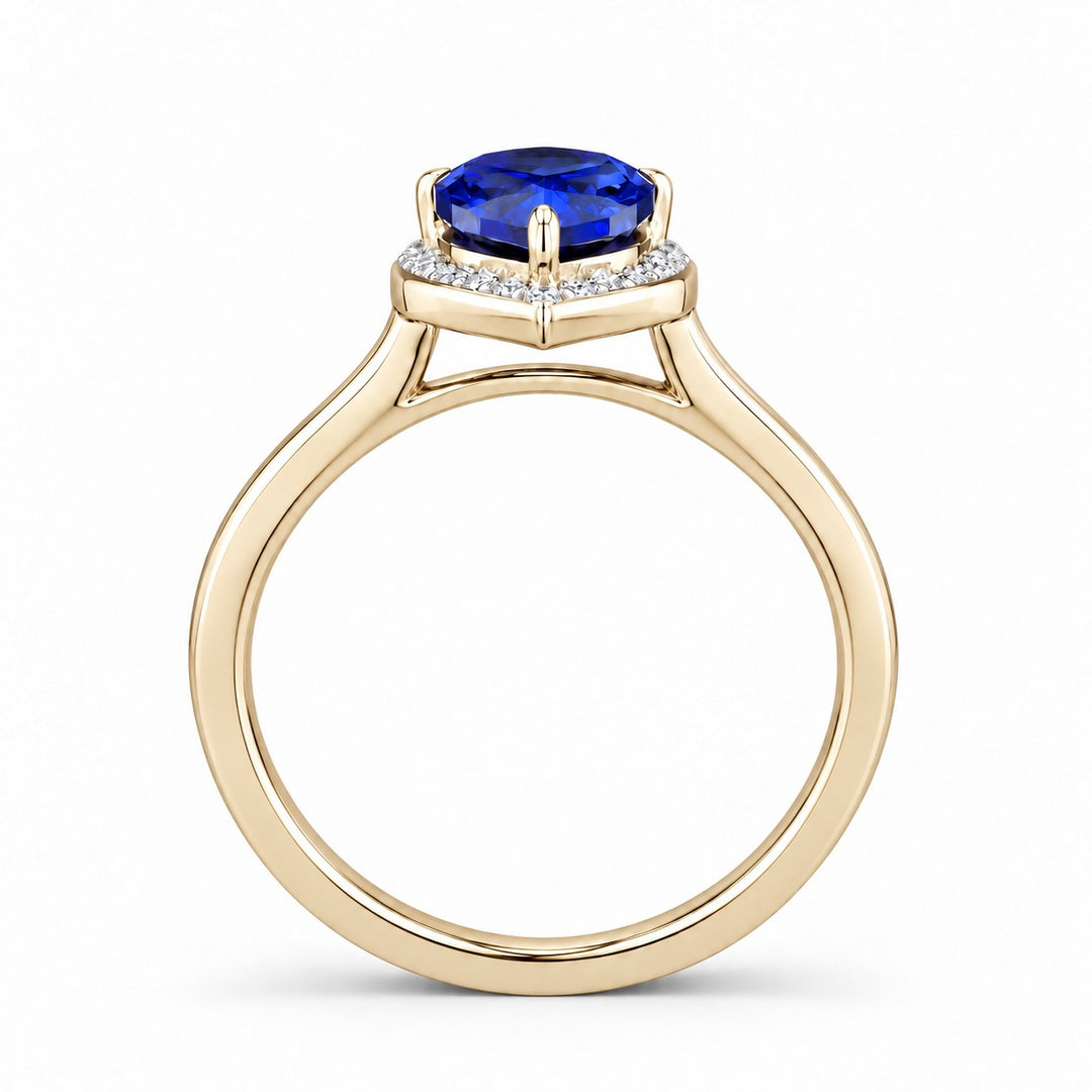 The Celestine — Blue Sapphire Halo Ring with Stacking Band in 14K yellow gold, profile view