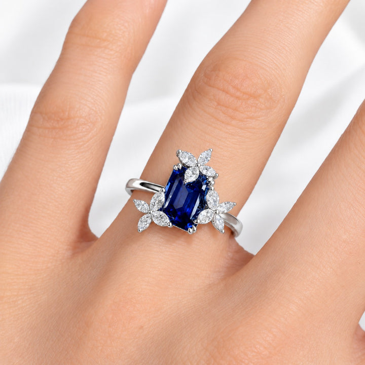 The Jardin — Emerald-Cut Sapphire Floral Ring in platinum, worn on hand