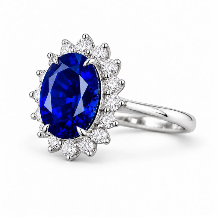 The Diana Royale — Royal Blue Sapphire Diamond Halo Ring in platinum, angled view