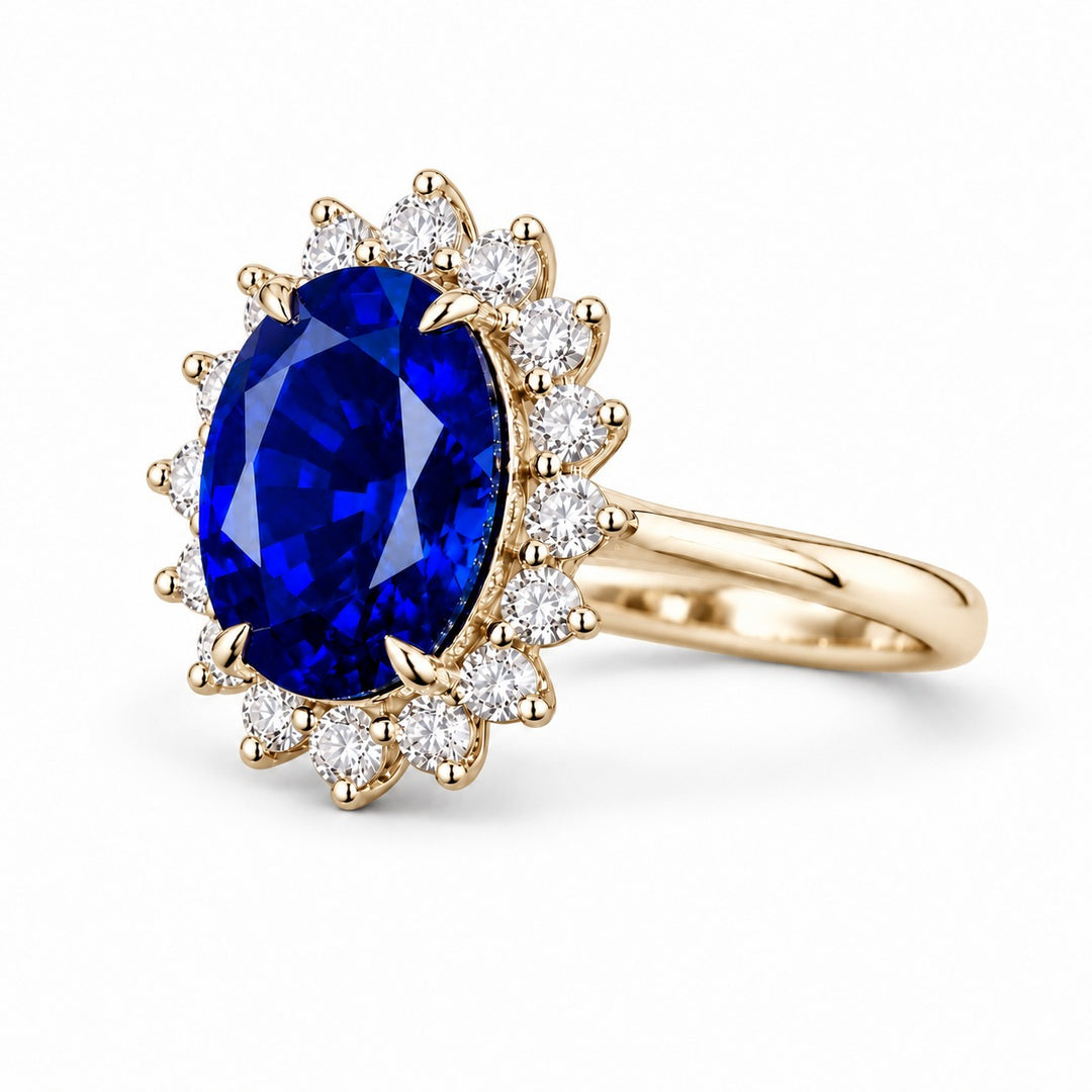 The Diana Royale — Royal Blue Sapphire Diamond Halo Ring in 14K yellow gold, angled view