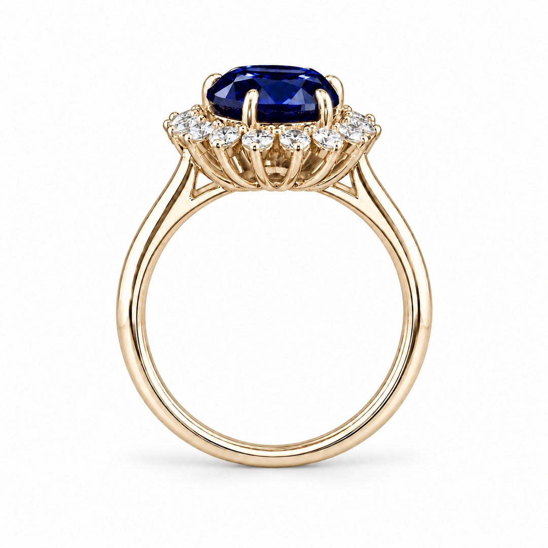 The Diana Royale — Royal Blue Sapphire Diamond Halo Ring in 14K yellow gold, profile view