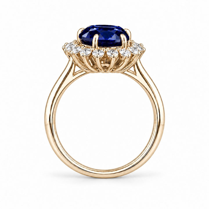 The Diana Royale — Royal Blue Sapphire Diamond Halo Ring in 14K yellow gold, profile view