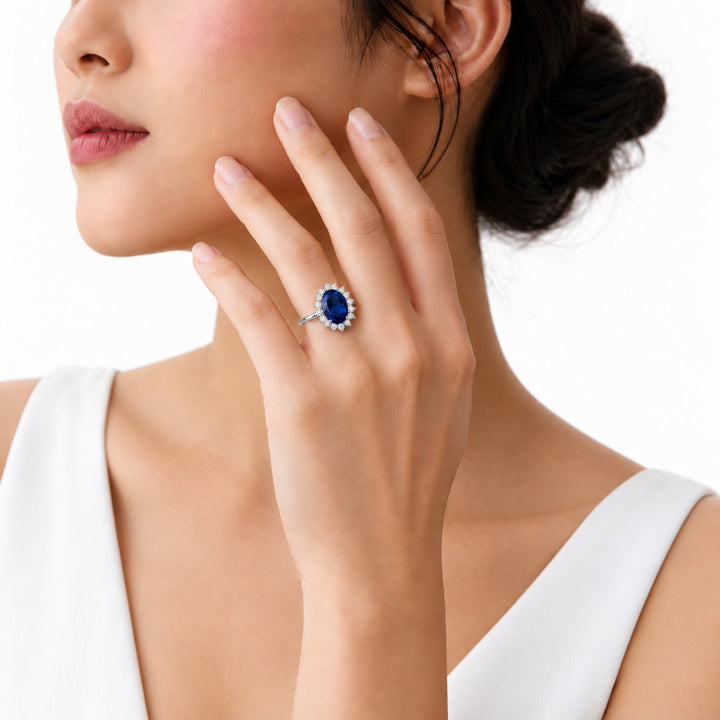 The Diana Royale — Royal Blue Sapphire Diamond Halo Ring in platinum, worn on hand