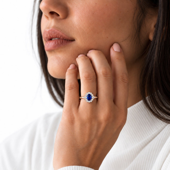 The Marielle — Petite Sapphire Halo Ring in 14K rose gold, worn on hand