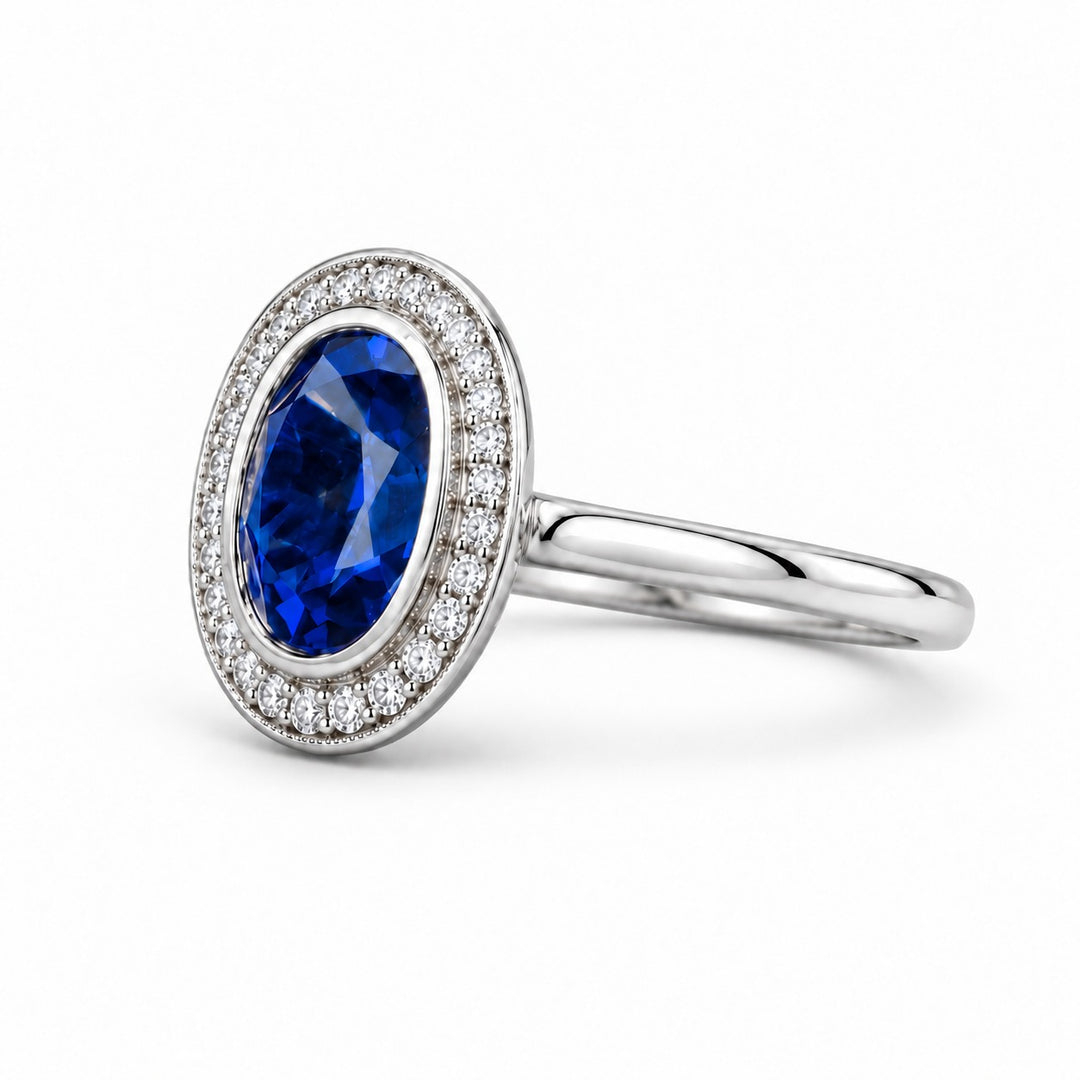 The Celine vintage lab sapphire halo ring in platinum, angled view