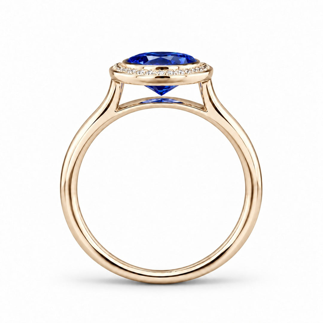 The Celine vintage lab sapphire halo ring in 14K yellow gold, profile view