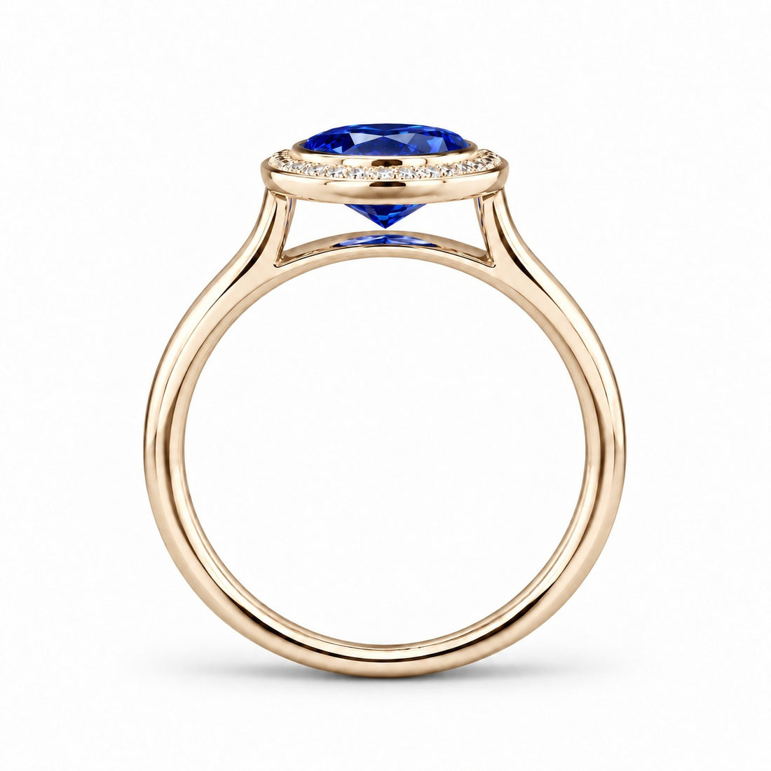 The Celine vintage lab sapphire halo ring in 14K yellow gold, profile view