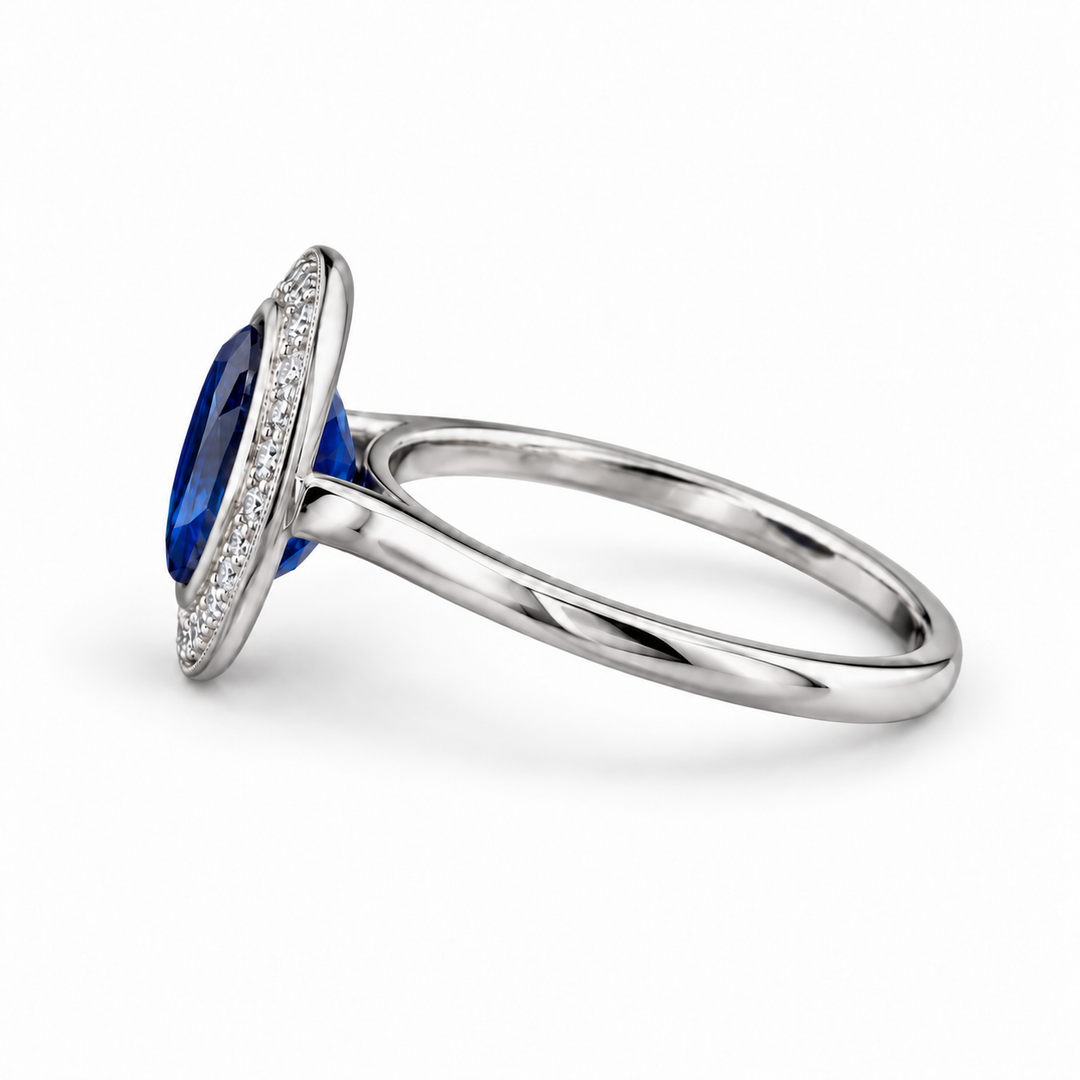 The Celine vintage lab sapphire halo ring in platinum, side view