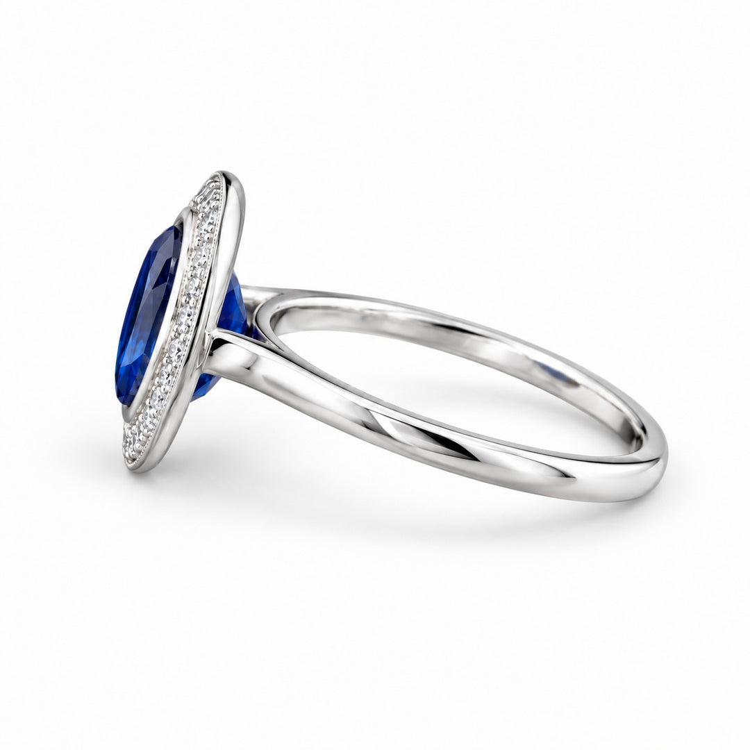 The Celine vintage lab sapphire halo ring in 14K white gold, side view