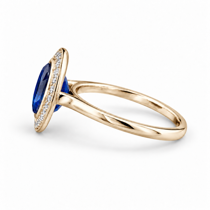 The Celine vintage lab sapphire halo ring in 14K yellow gold, side view