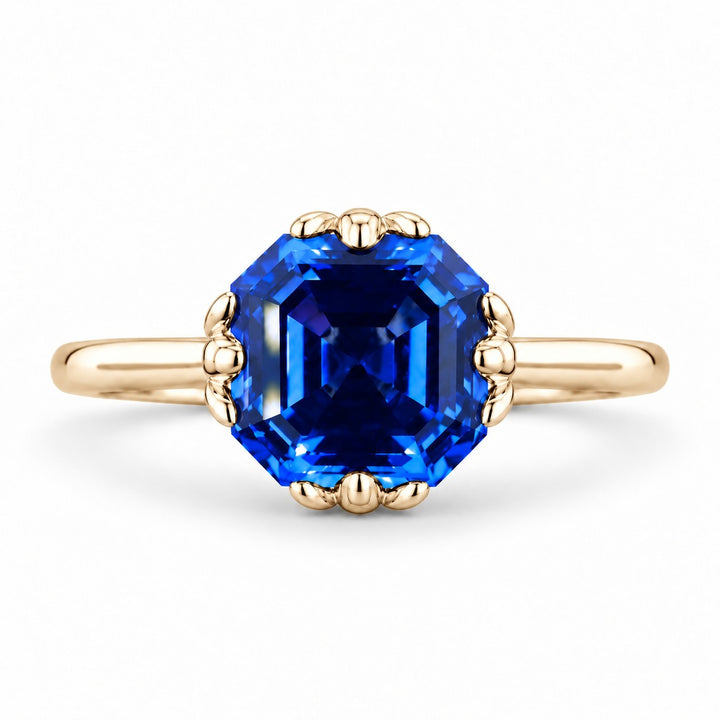The Verena — Blue Asscher Sapphire with Leaf Prongs Ring in 14K yellow gold, front view