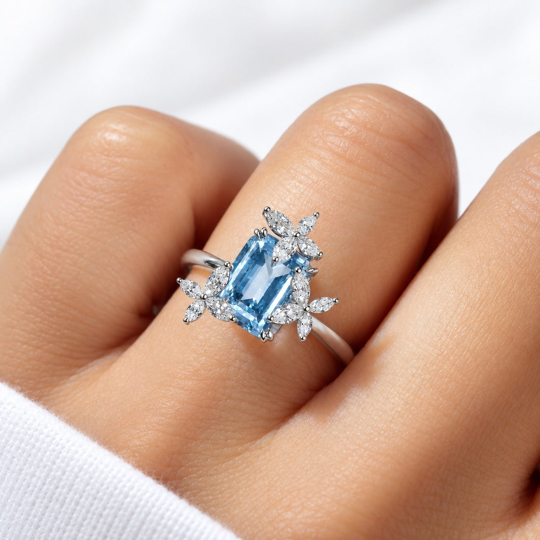 The Jardin light blue lab sapphire floral ring in 14K white gold, worn on hand