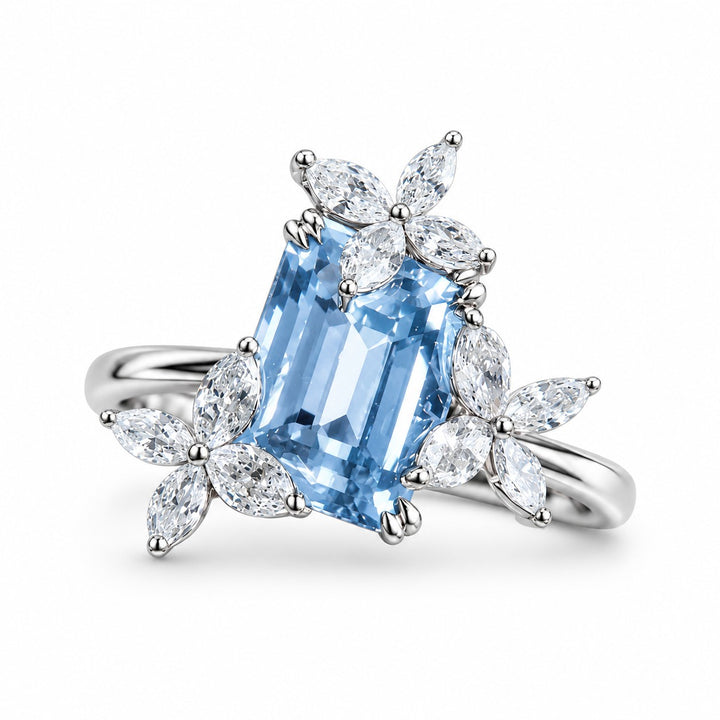 The Jardin — Emerald-Cut Light Blue Sapphire Floral Ring in 14K white gold, front view