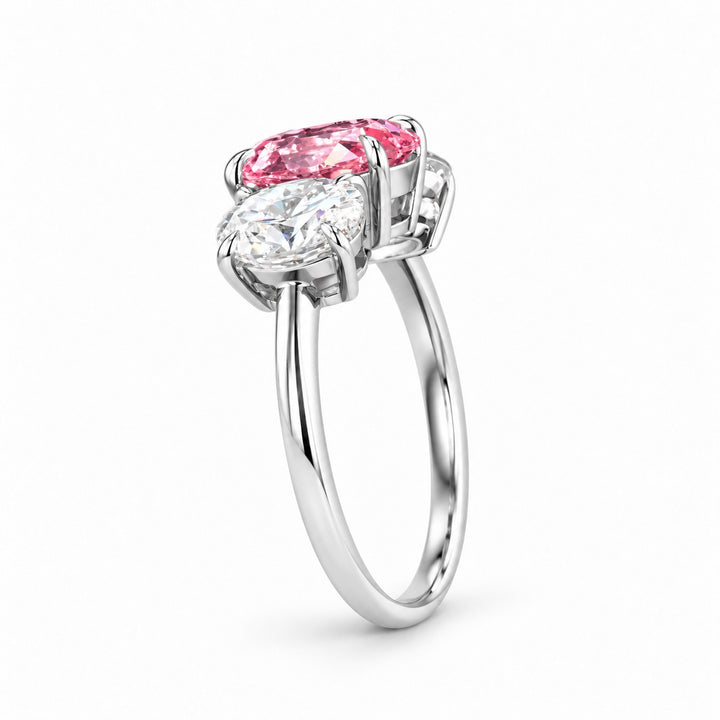 The Étoile oval pink lab sapphire three-stone ring in 14K white gold, profile view