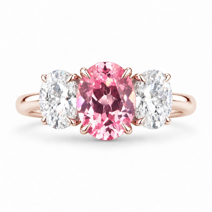 The Étoile — Oval Three-Stone Pink Sapphire Ring in 14K rose gold, front view