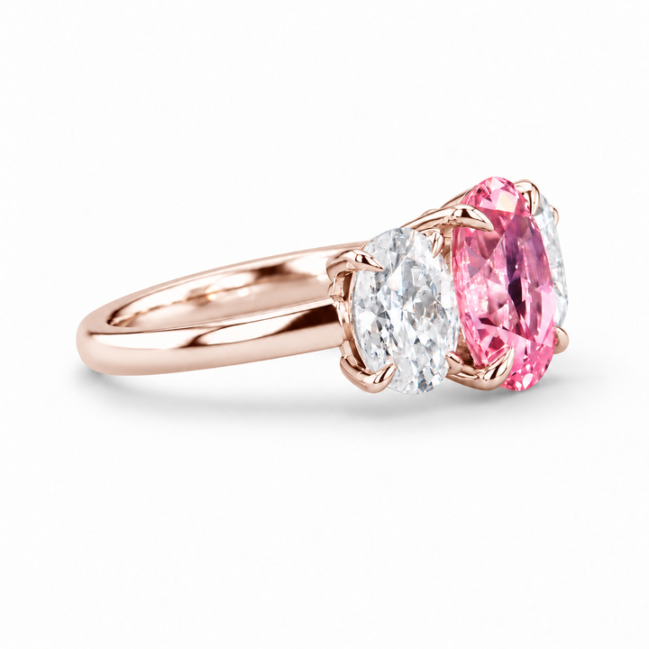 The Étoile oval pink lab sapphire three-stone ring in 14K rose gold, side view