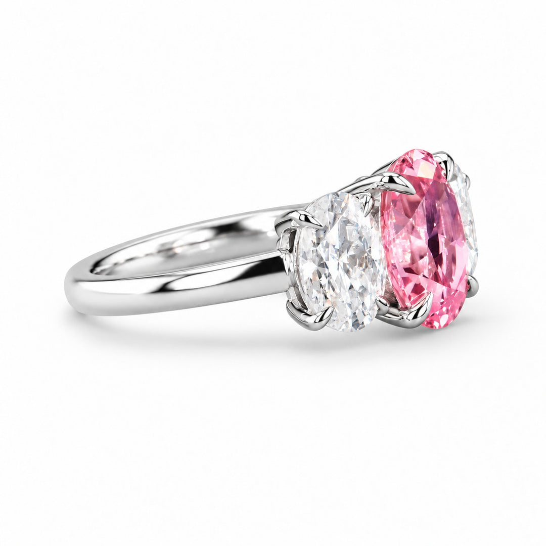 The Étoile oval pink lab sapphire three-stone ring in 14K white gold, side view