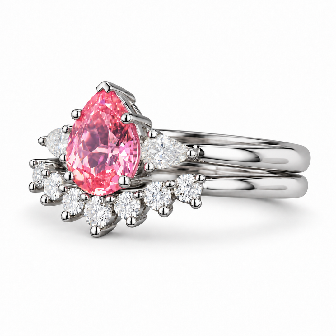 The Aubrey Set pink pear sapphire three-stone ring and diamond band in platinum, angled view