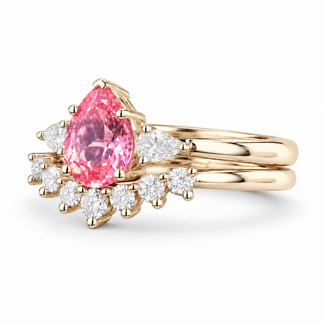 The Aubrey Set pink pear sapphire three-stone ring and diamond band in 14K yellow gold, angled view