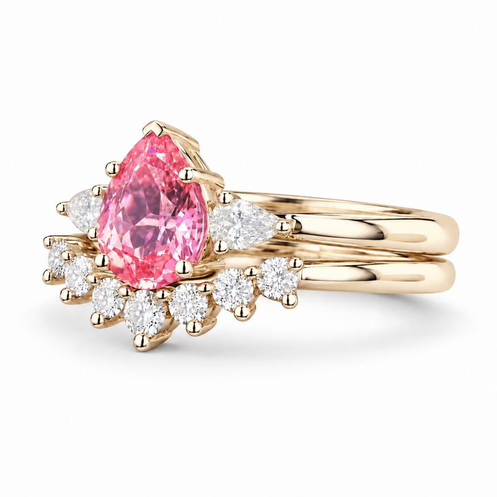 The Aubrey Set pink pear sapphire three-stone ring and diamond band in 14K yellow gold, angled view