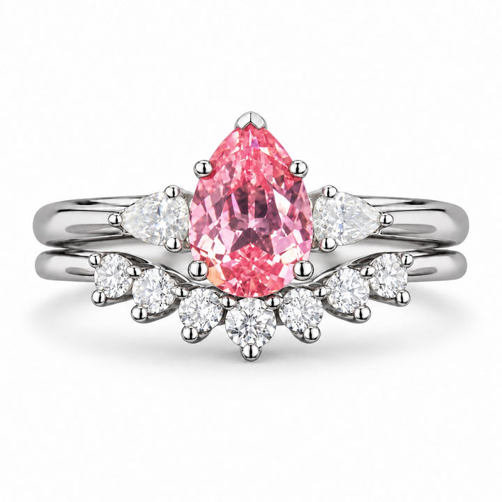 The Aubrey Set — Pink Pear Sapphire Three-Stone Ring with Diamond Stacking Band in platinum, front view