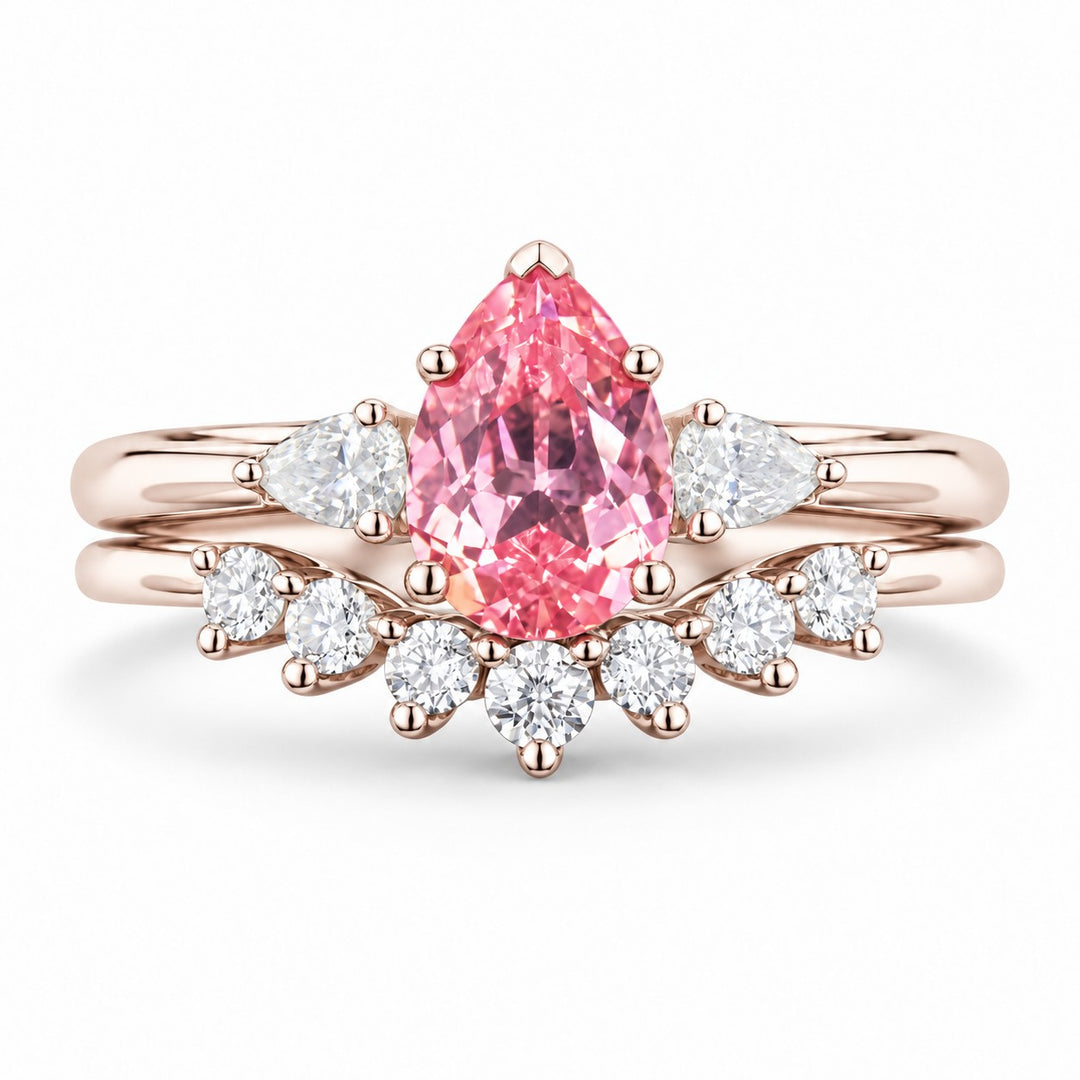 The Aubrey Set — Pink Pear Sapphire Three-Stone Ring with Diamond Stacking Band in 14K rose gold, front view