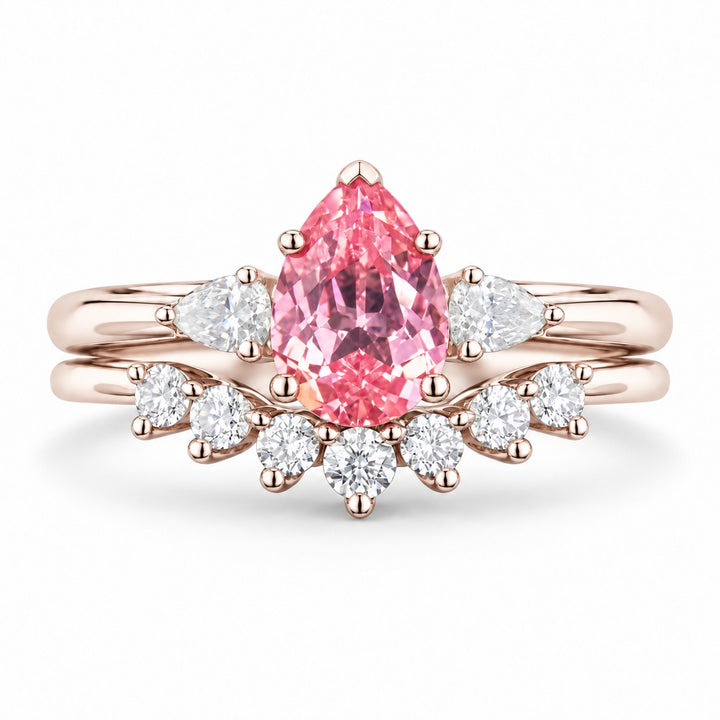 The Aubrey Set — Pink Pear Sapphire Three-Stone Ring with Diamond Stacking Band in 14K rose gold, front view