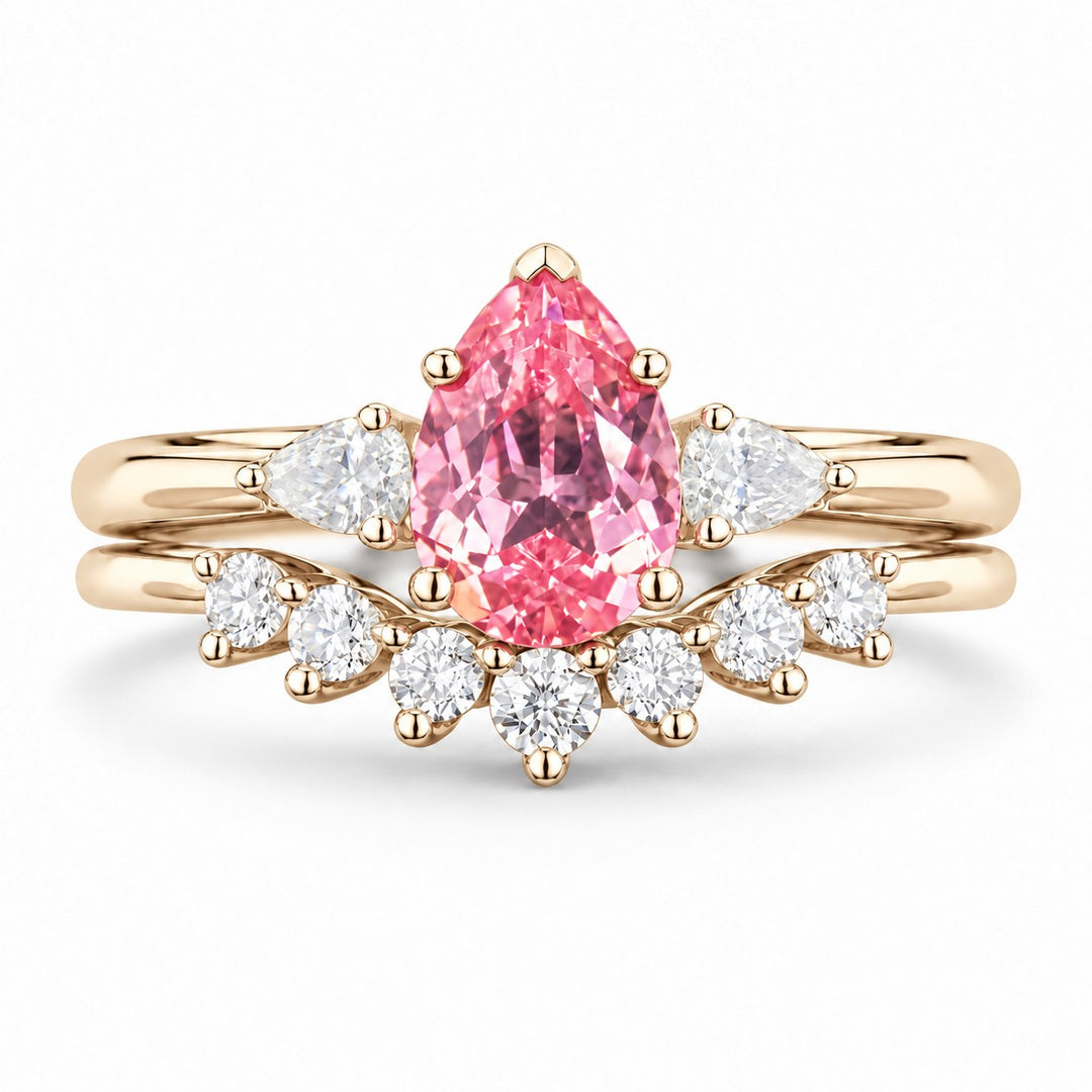 The Aubrey Set — Pink Pear Sapphire Three-Stone Ring with Diamond Stacking Band in 14K yellow gold, front view