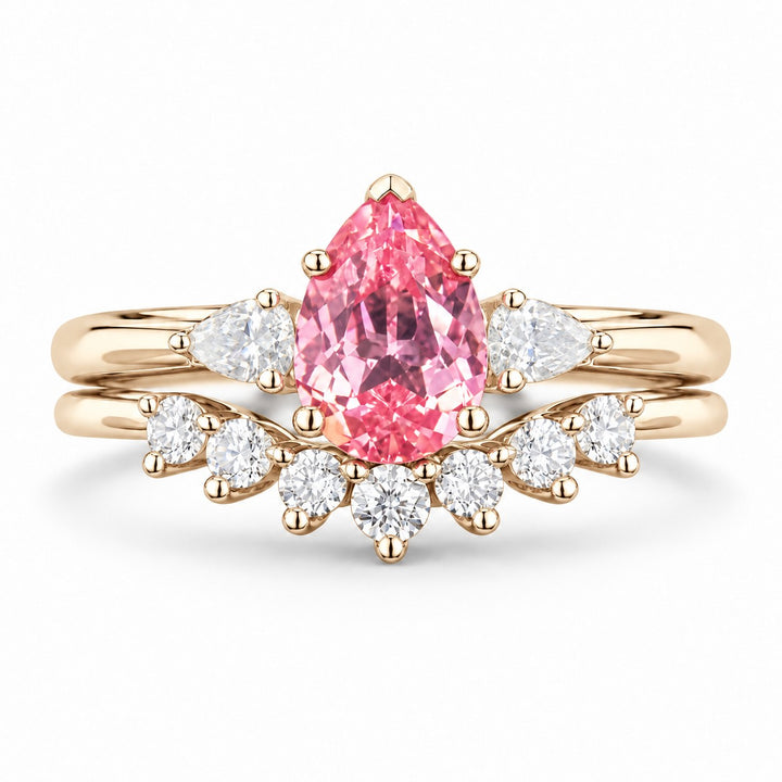 The Aubrey Set — Pink Pear Sapphire Three-Stone Ring with Diamond Stacking Band in 14K yellow gold, front view